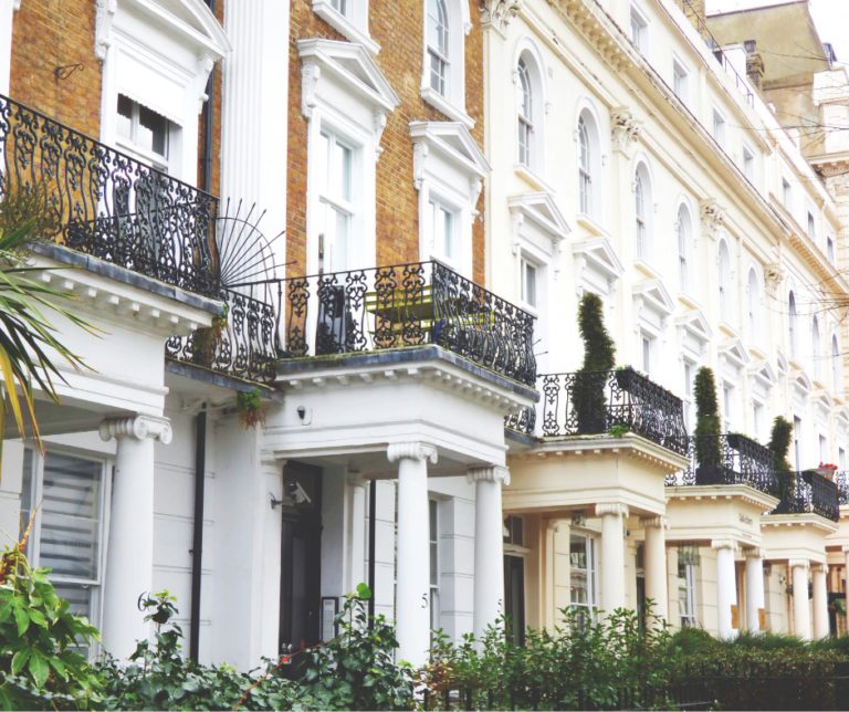 Row of white stucco terraced houses in London